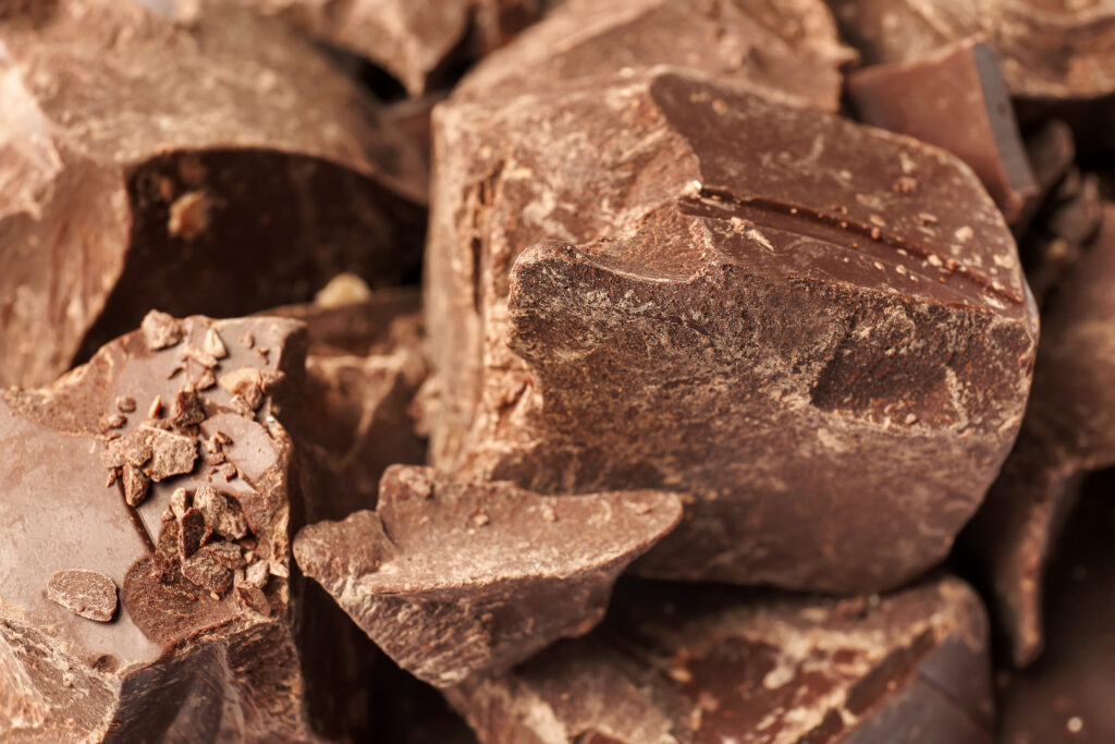 Delicious black chocolate chunks (natural dark cocoa mass from Africa), closeup